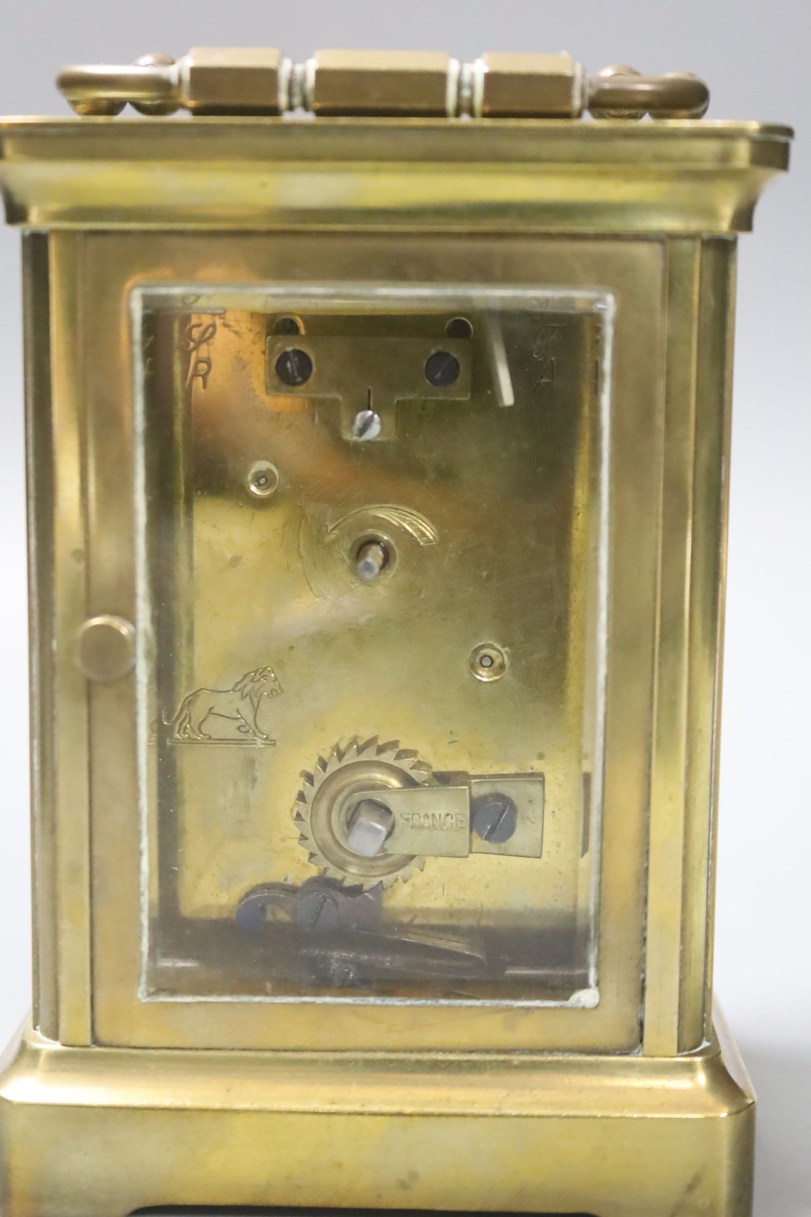 A cased brass carriage timepiece